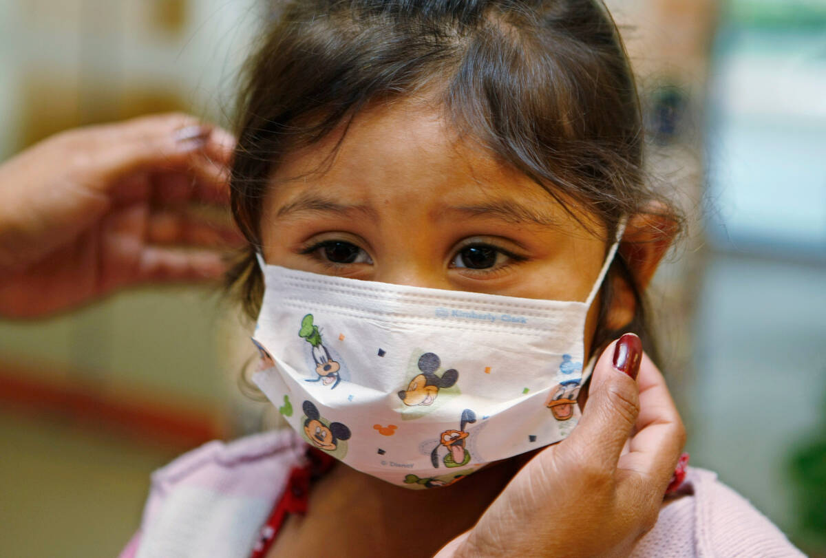 FILE - Lucile Packard Children's Hospital at Stanford visitor Sheila Garcia, 3, wears befo ...