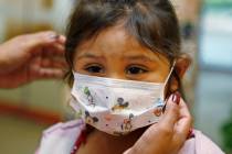 FILE - Lucile Packard Children's Hospital at Stanford visitor Sheila Garcia, 3, wears befo ...