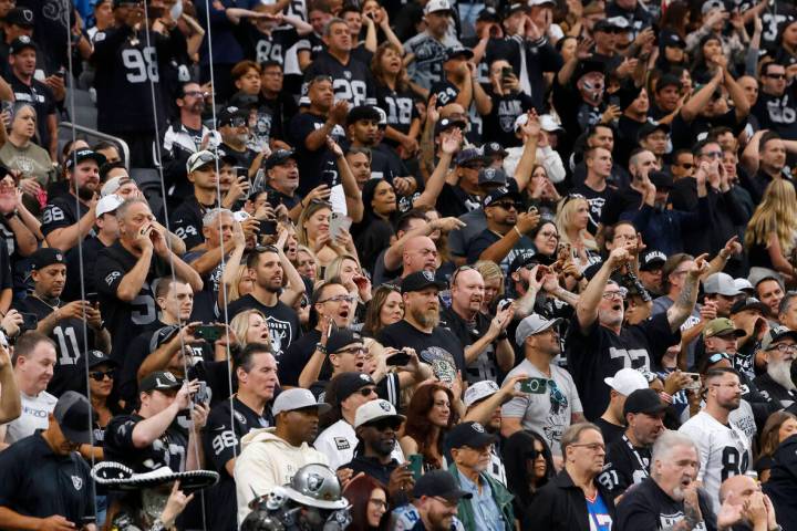 Raiders fans cheer for their team as they watch an NFL game against Tennessee Titans at Allegia ...