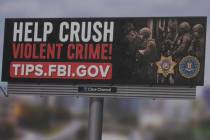 The FBI billboards, which went live across the valley, said "Help crush violent crime!" with th ...