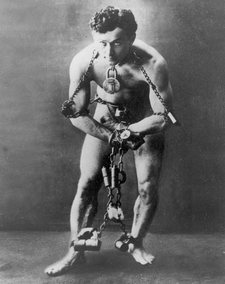 FILE - This circa 1899, file photo, shows escape artist Harry Houdini in chains. The Philadelph ...