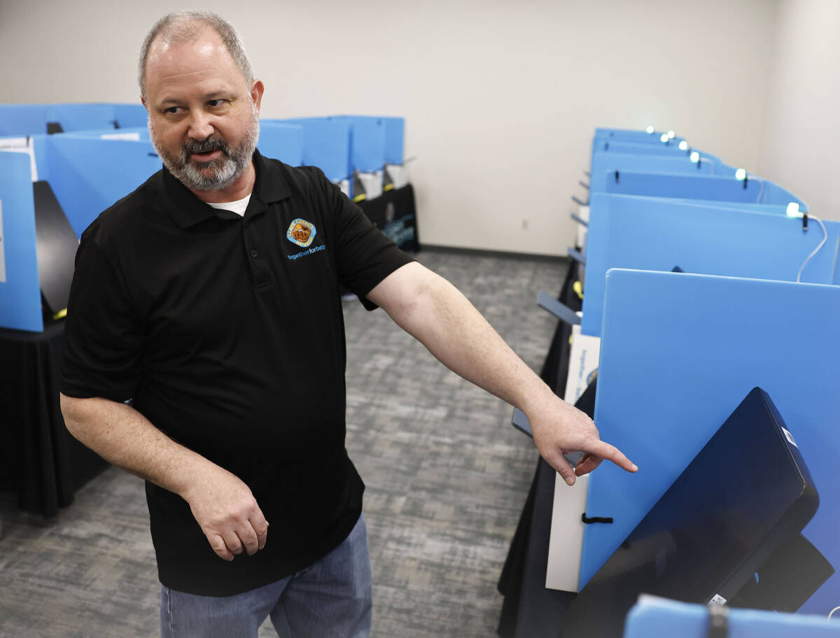 Clark County Election Department spokesperson Dan Kulin demonstrates step two, marking and prin ...