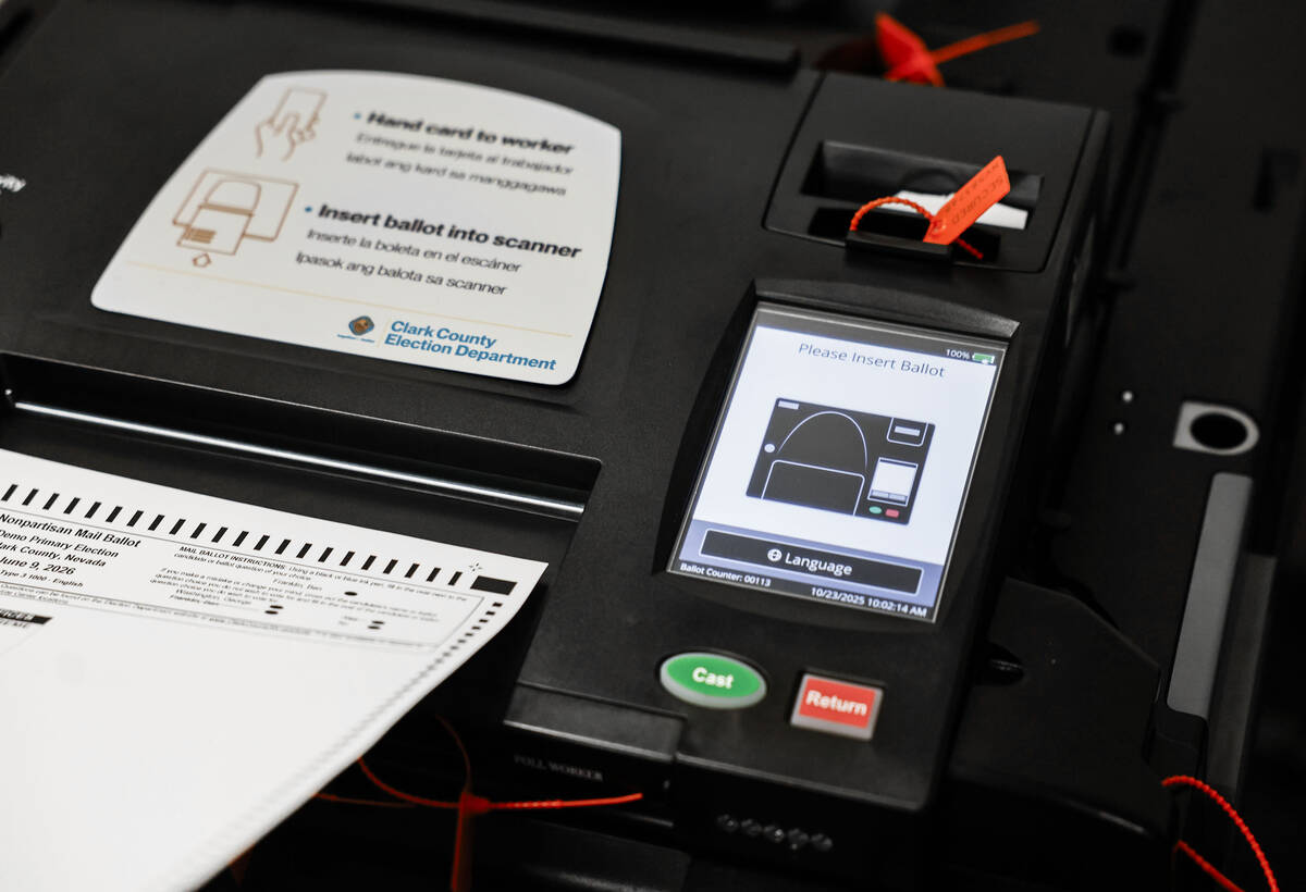 Lorena Portillo, (out of frame), Clark County Registrar of Voters, demonstrates step three, sca ...