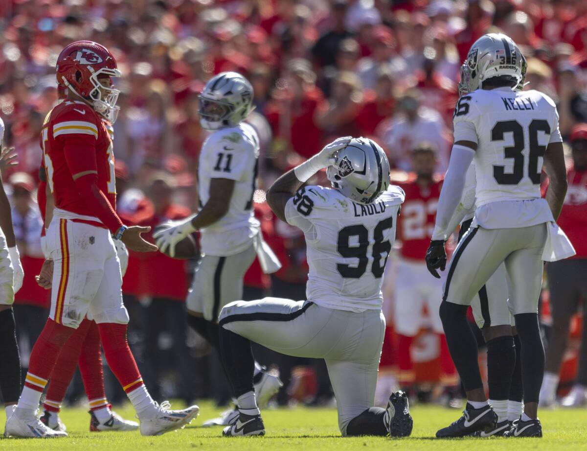 Raiders defensive tackle Jonah Laulu (96) reacts after failing to bring in a tipped pass during ...