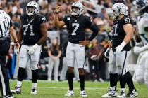 Raiders quarterback Geno Smith (7) reacts after throwing an interception during the second half ...