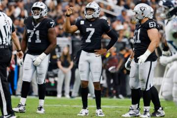 Raiders quarterback Geno Smith (7) reacts after throwing an interception during the second half ...
