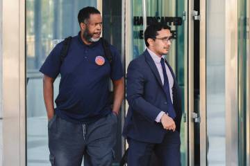 Former NBA assistant coach and player Damon Jones, left, leaves the Lloyd George U.S. Courthous ...