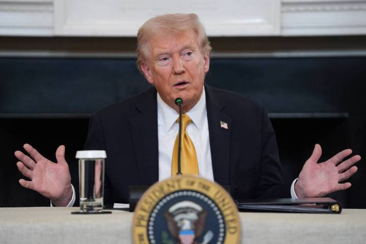 President Donald Trump answers questions from reporters during a roundtable on criminal cartels ...