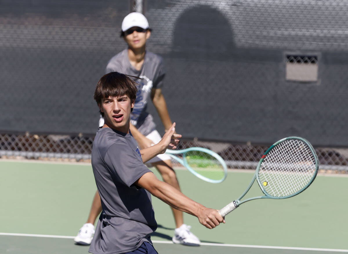 The Meadows Matt Maddox, front, watches his return as his tennis partner Steven Tian looks on d ...