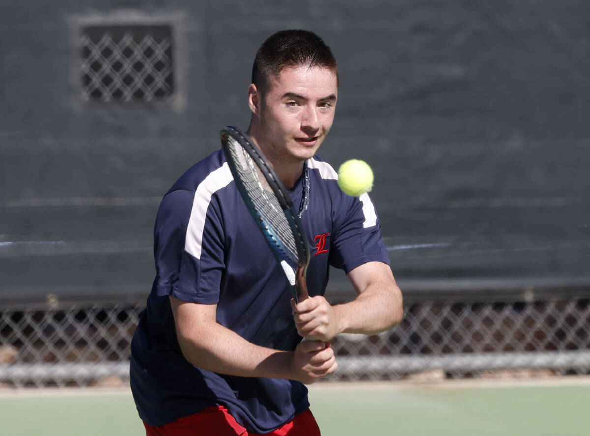 Liberty's Connor Casey returns the ball during the Class 4A boys tennis team State Champio ...