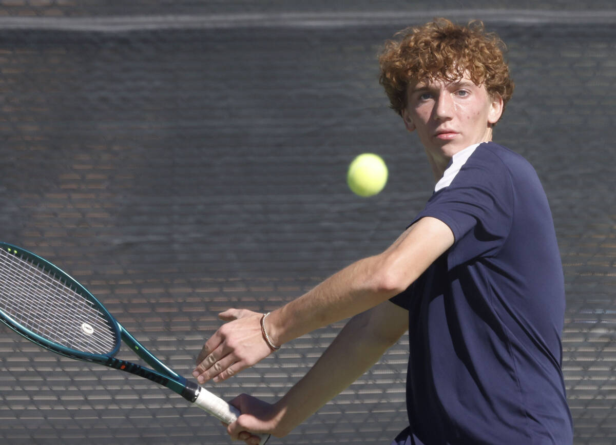 Liberty's Matt Loterhos returns the ball during the Class 4A boys tennis team State Champi ...