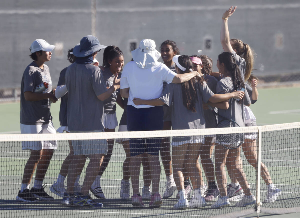 The Meadows girls' tennis team and coaches celebrate after defeating Spanish Springs in th ...