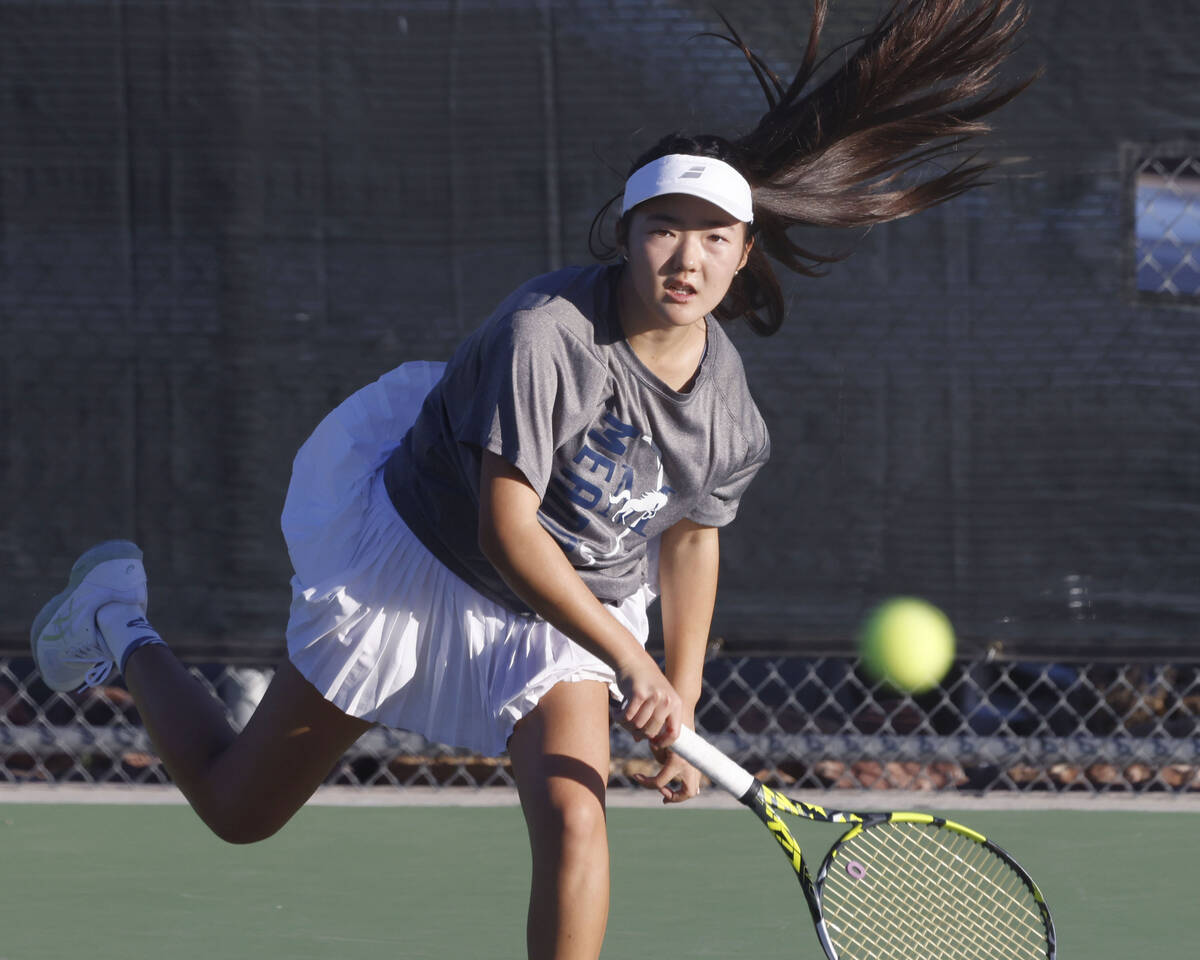The Meadows Somi Song serves against Spanish Springs during the Class 4A girls tennis team Stat ...