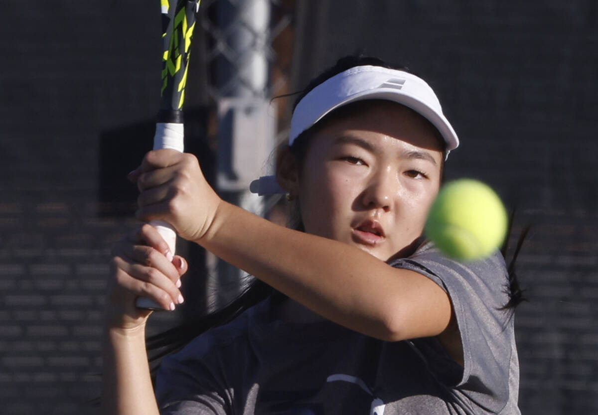 The Meadows Somi Song returns the ball against Spanish Springs during the Class 4A girls tennis ...