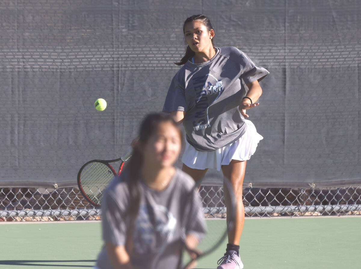 The Meadows Sophia Gallardo returns the ball against Spanish Springs as her tennis partner Cade ...