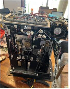 Image of a DeckMate 2 shuffler taken apart on a table, from defendant Shane Hennen's iCloud acc ...