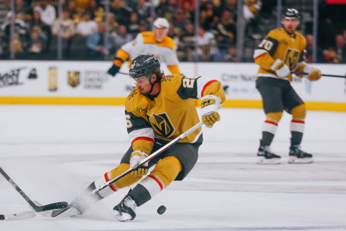 Golden Knights right wing Alexander Holtz (26) skates with the puck during the second period of ...
