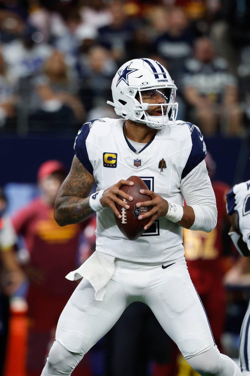 Dallas Cowboys quarterback Dak Prescott (4) looks to pass during a NFL football game against th ...