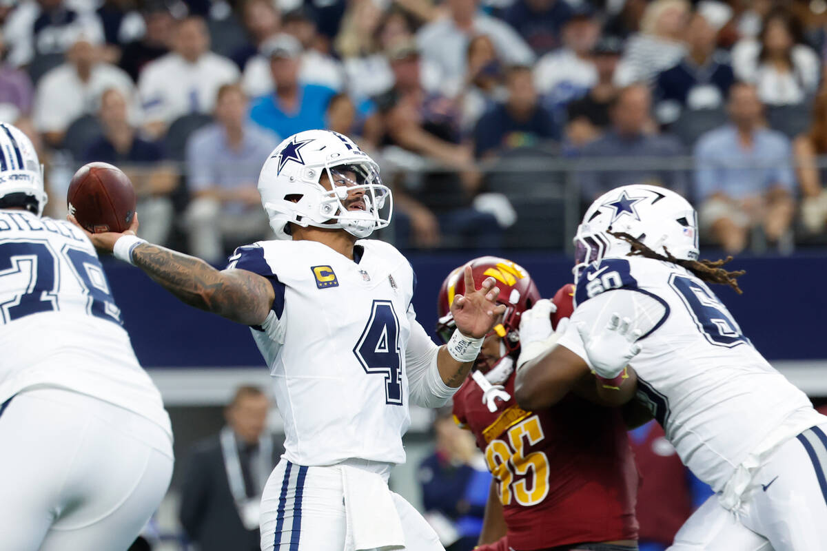 Dallas Cowboys quarterback Dak Prescott (4) looks to pass during a NFL football game against th ...