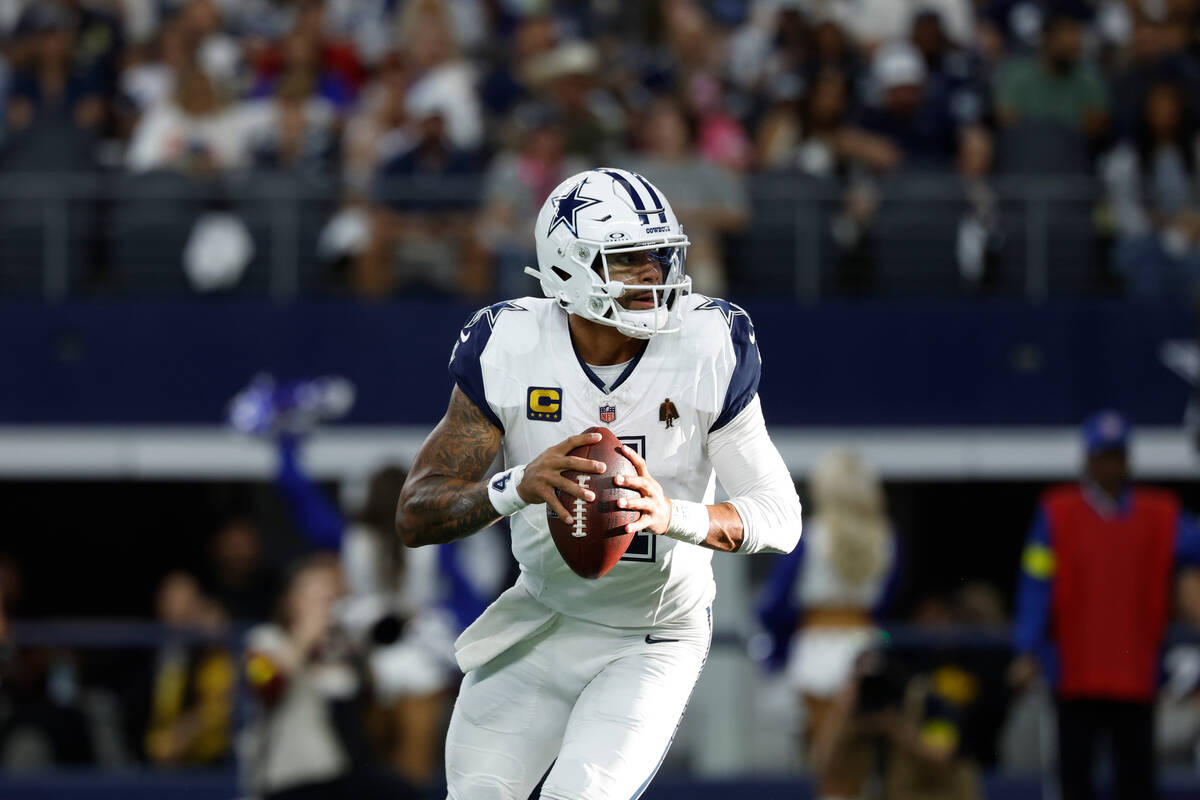 Dallas Cowboys quarterback Dak Prescott (4) looks to pass during a NFL football game against th ...