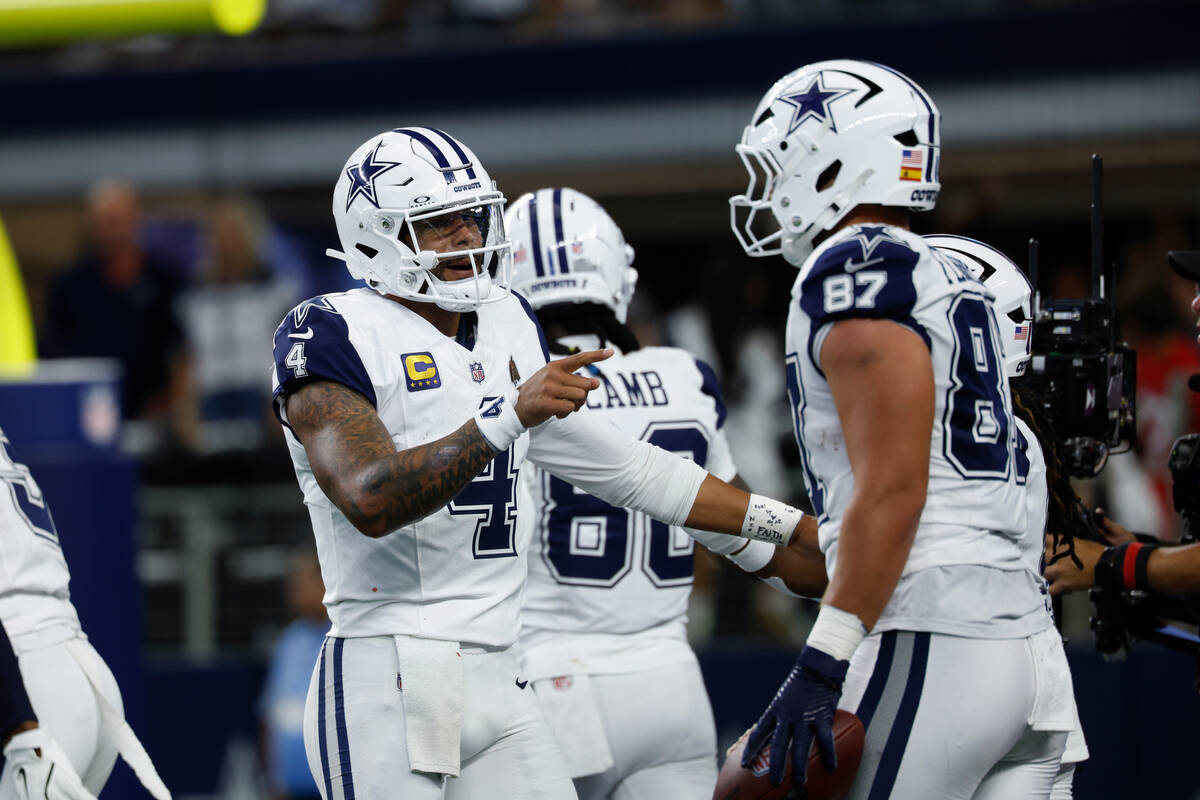 Dallas Cowboys quarterback Dak Prescott (4) celebrates after a touchdown during a NFL football ...