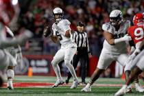 Oregon quarterback Dante Moore (5) looks to pass the ball during the first half of an NCAA coll ...