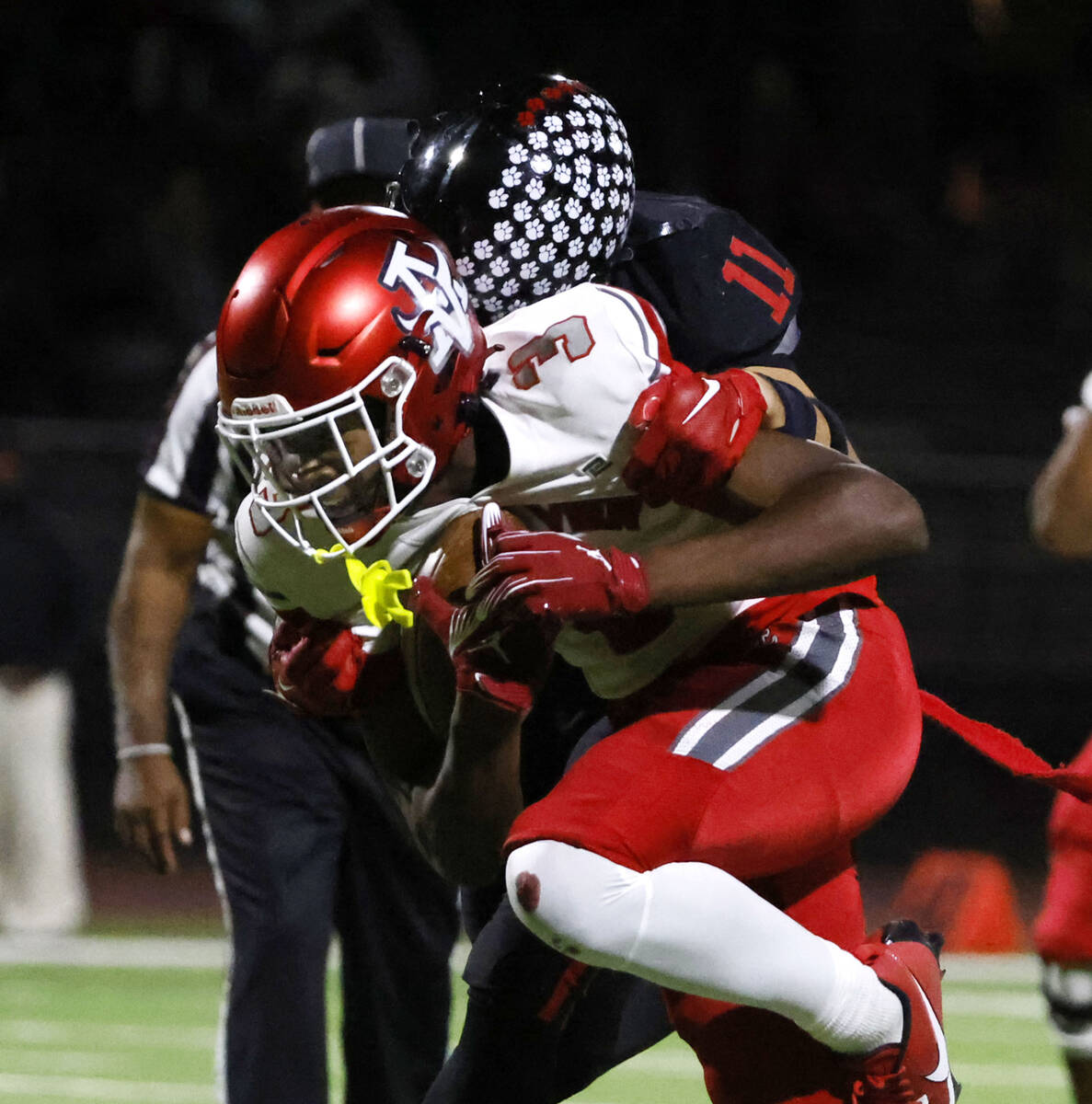 Arbor View's wide receiver Damani Warren (3) is taken down by Las Vegas High's defens ...