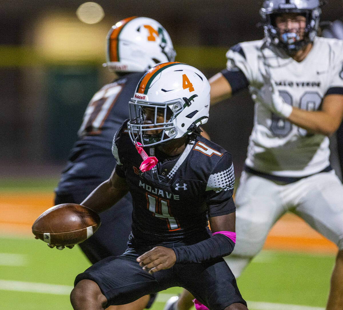 Mojave quarterback RaJahn Butler (4) breaks free for a run against Palo Verde during the first ...