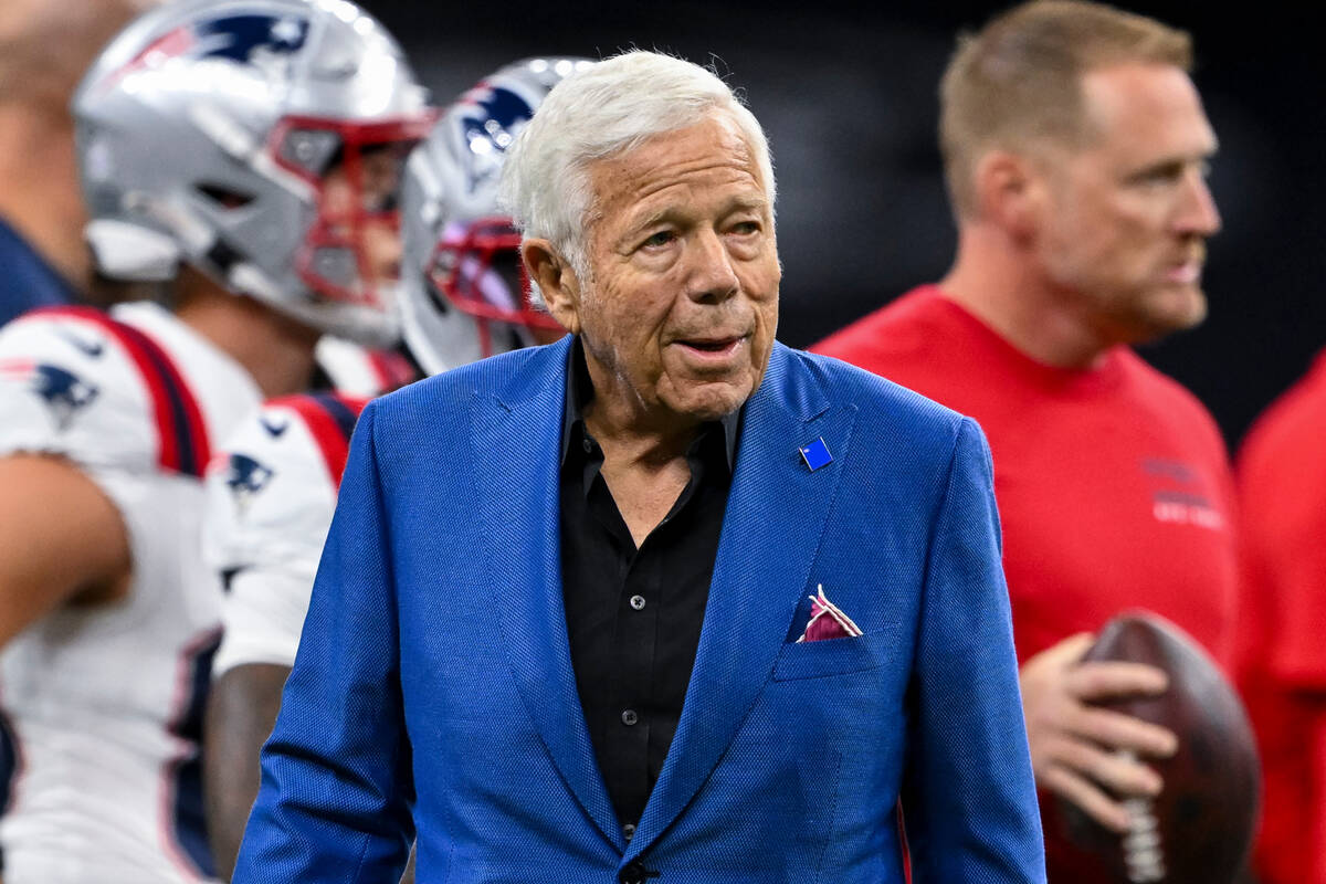 FILE - New England Patriots Chairman and CEO Robert Kraft walks on the field prior to an NFL fo ...