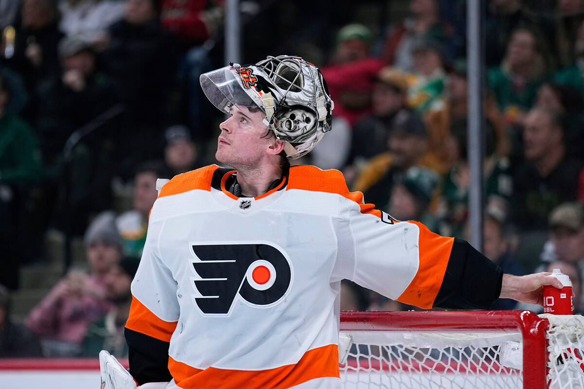 Philadelphia Flyers goaltender Carter Hart waits for play to resume during the third period of ...