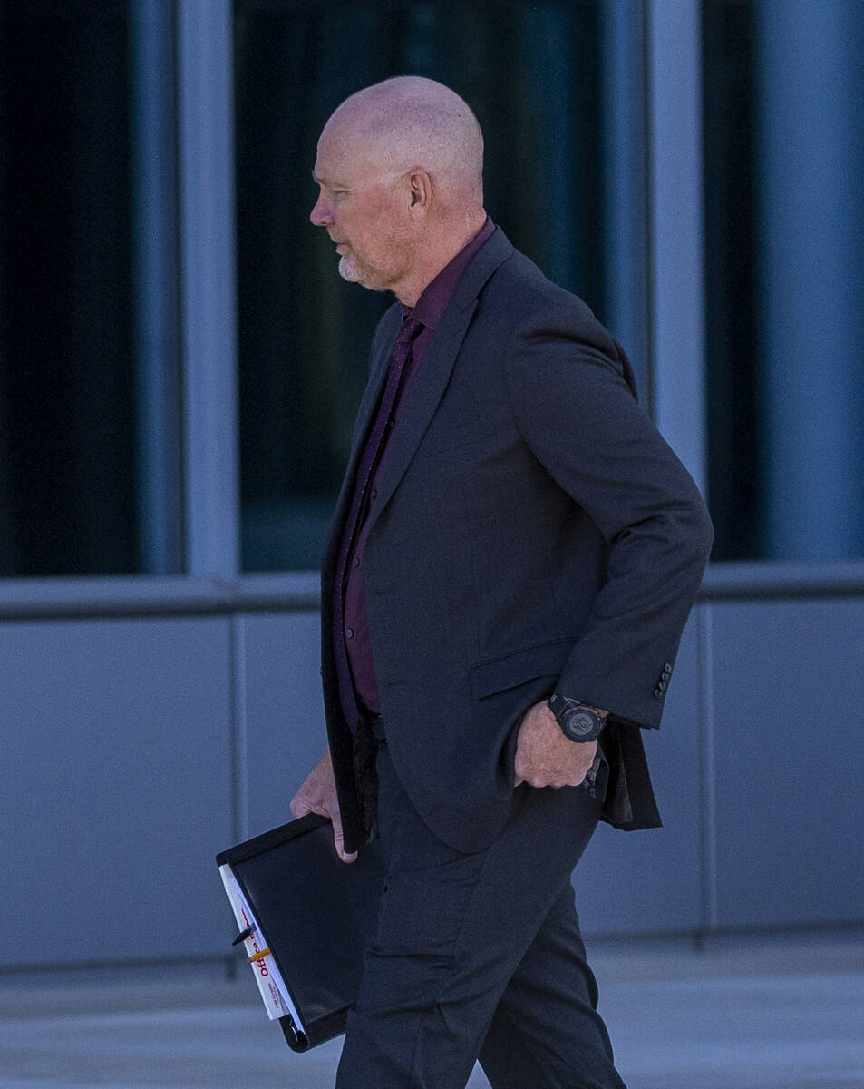 Metropolitan Police Department officer Andrew Locher departs the Lloyd George Federal Courthous ...