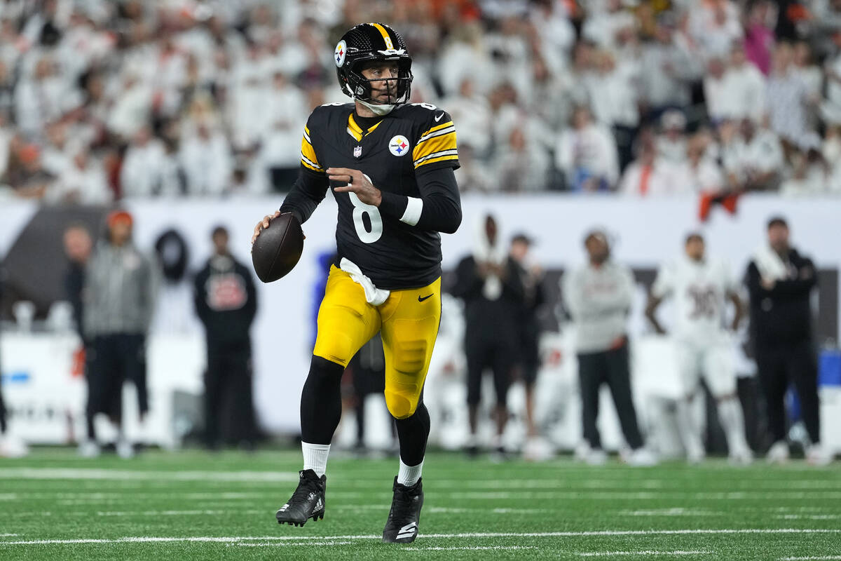Pittsburgh Steelers quarterback Aaron Rodgers (8) looks to throw during the first half of an NF ...