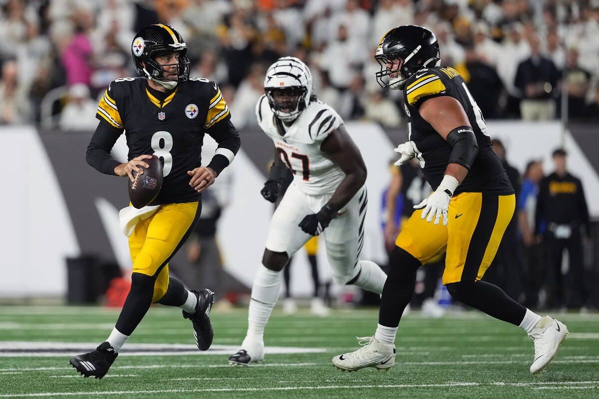 Pittsburgh Steelers quarterback Aaron Rodgers (8) looks to throw during an NFL football game ag ...