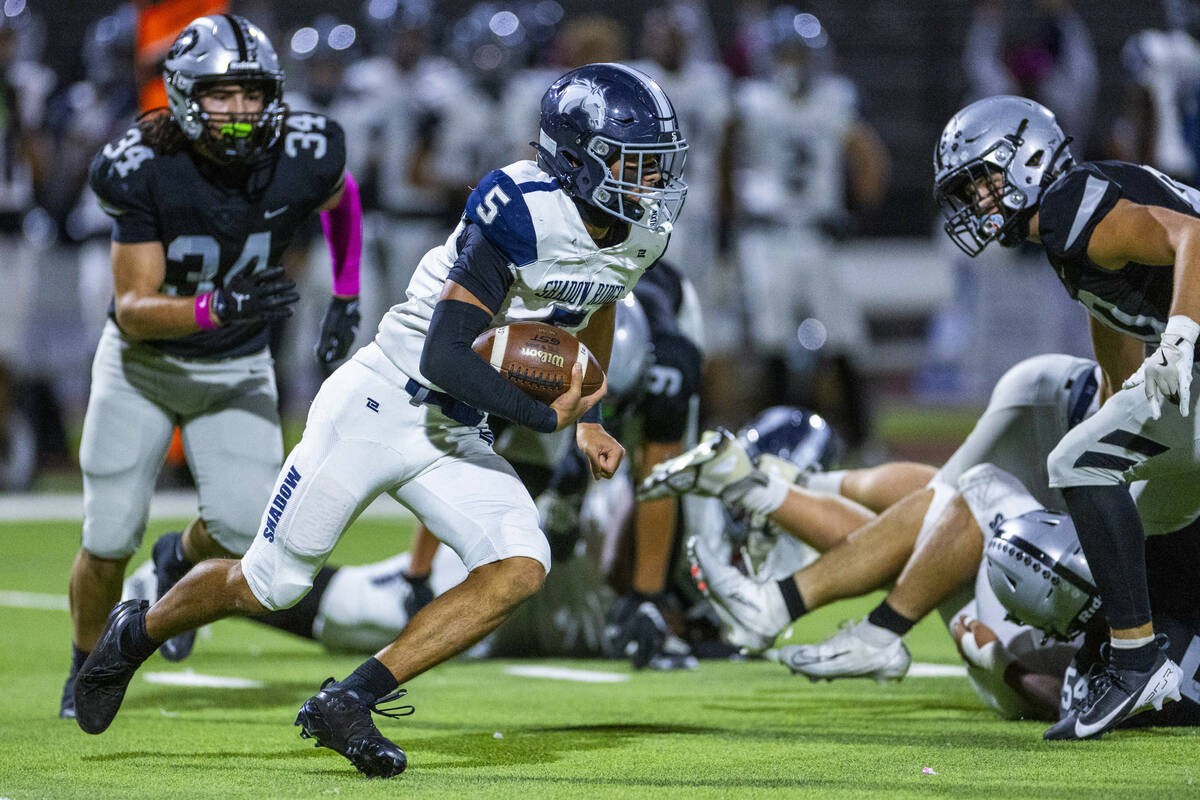 Shadow Ridge quarterback Isaiah Ruiz (5) takes off on a long run as Palo Verde's Trinidad ...