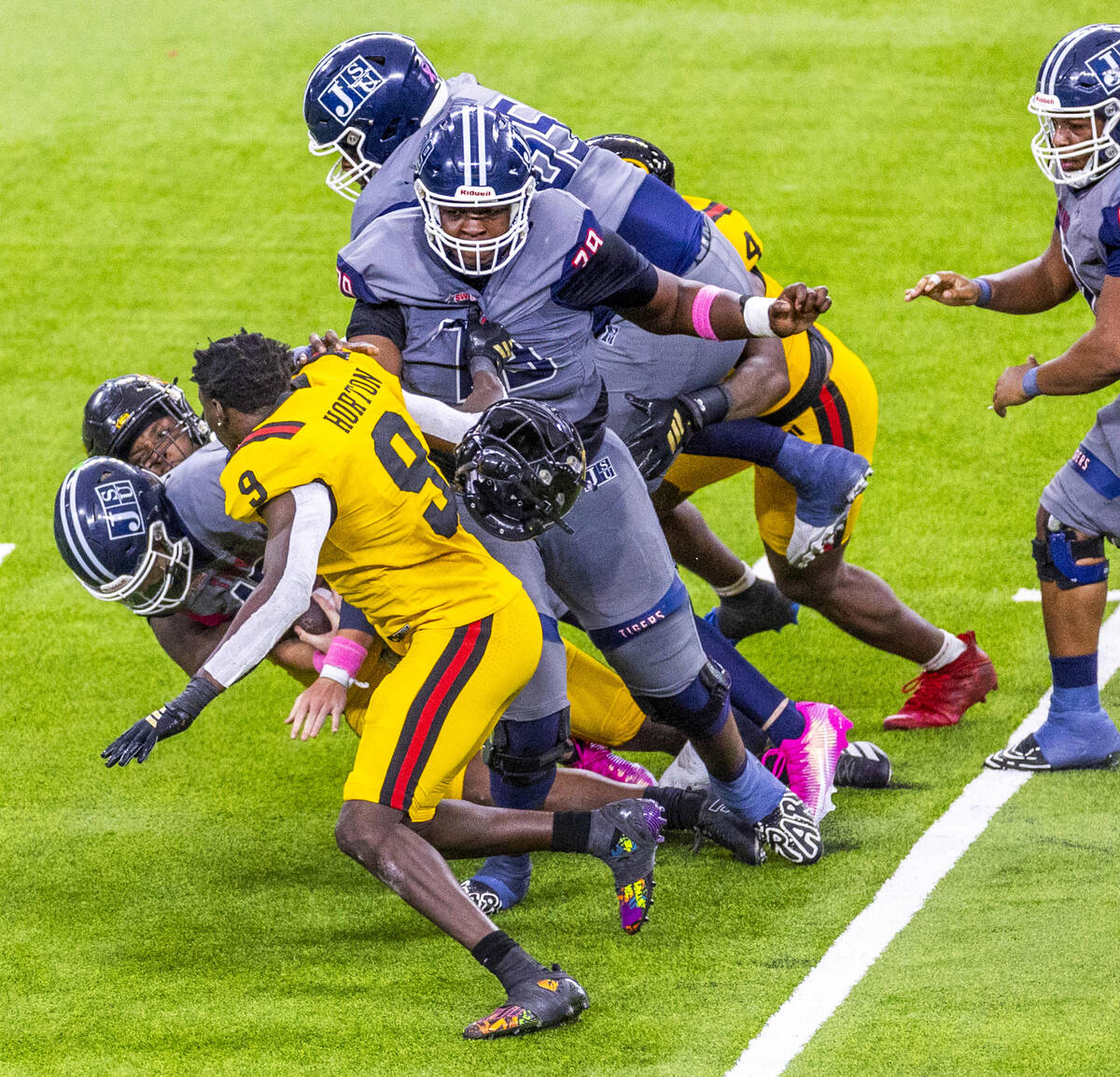 Grambling State Tigers linebacker Jon Horton (9) loses his helmet after helping to sack Jackson ...