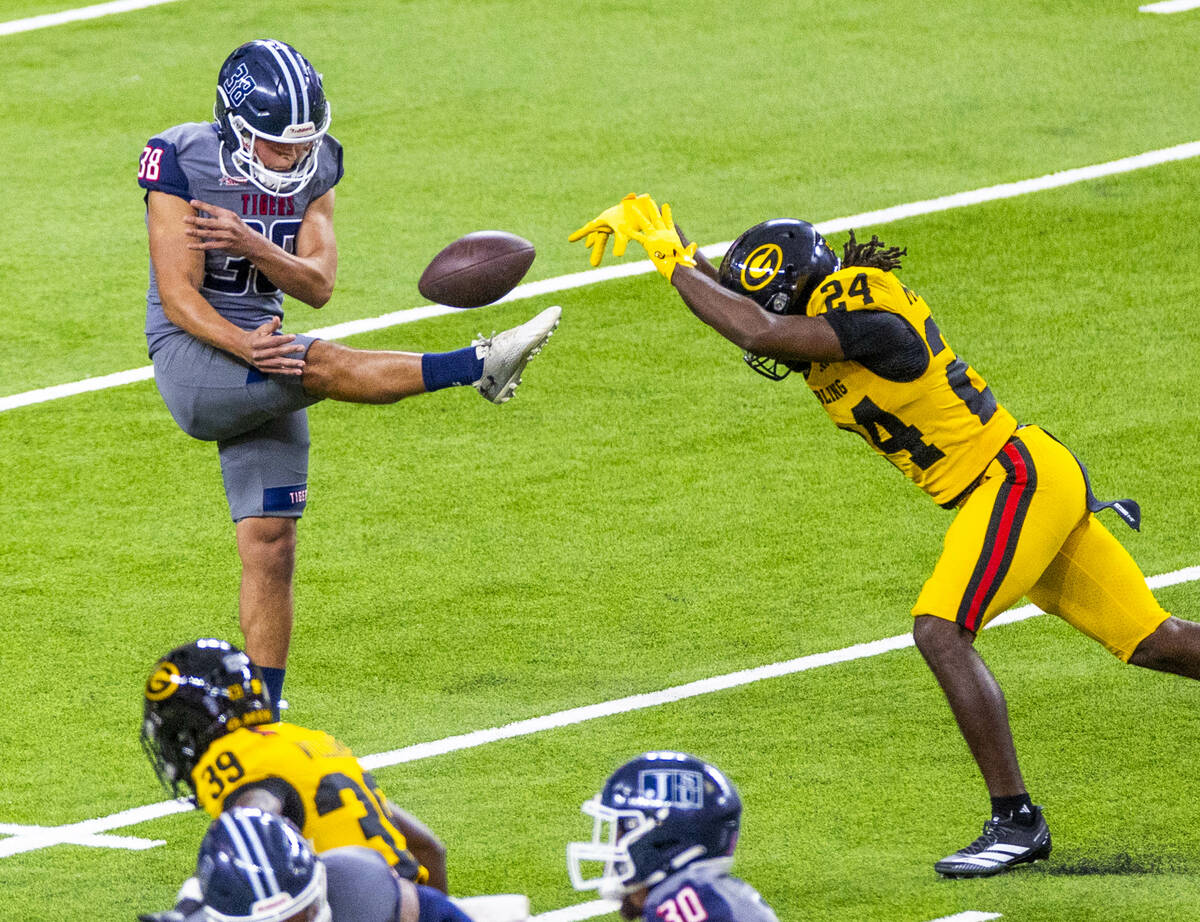 Jackson State punter Gerardo Baeza (38) has a kick blocked by Grambling State Tigers defender C ...
