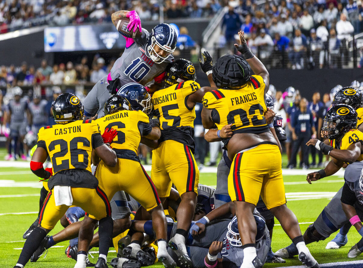 Jackson State Tigers running back Donerio Davenport (10) attempts to leap over Grambling State ...