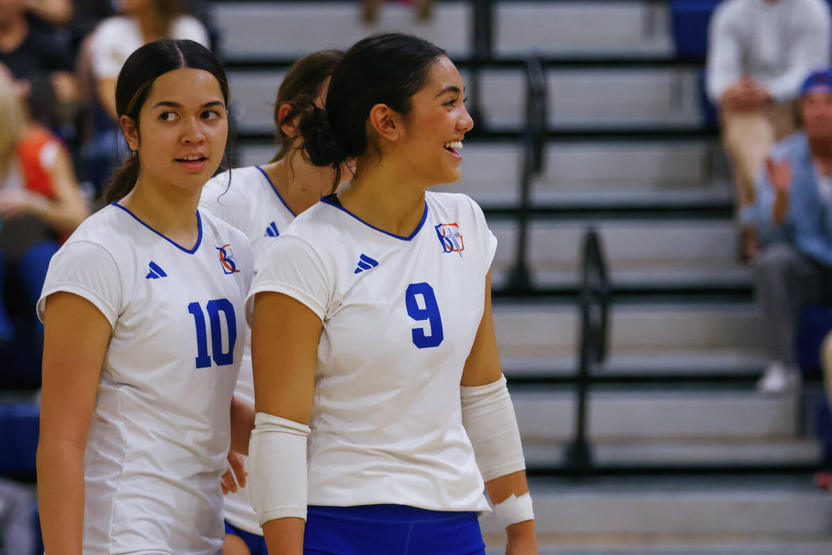 Bishop Gorman setter Trinity Thompson (9) laughs with teammates between plays during a volleyba ...