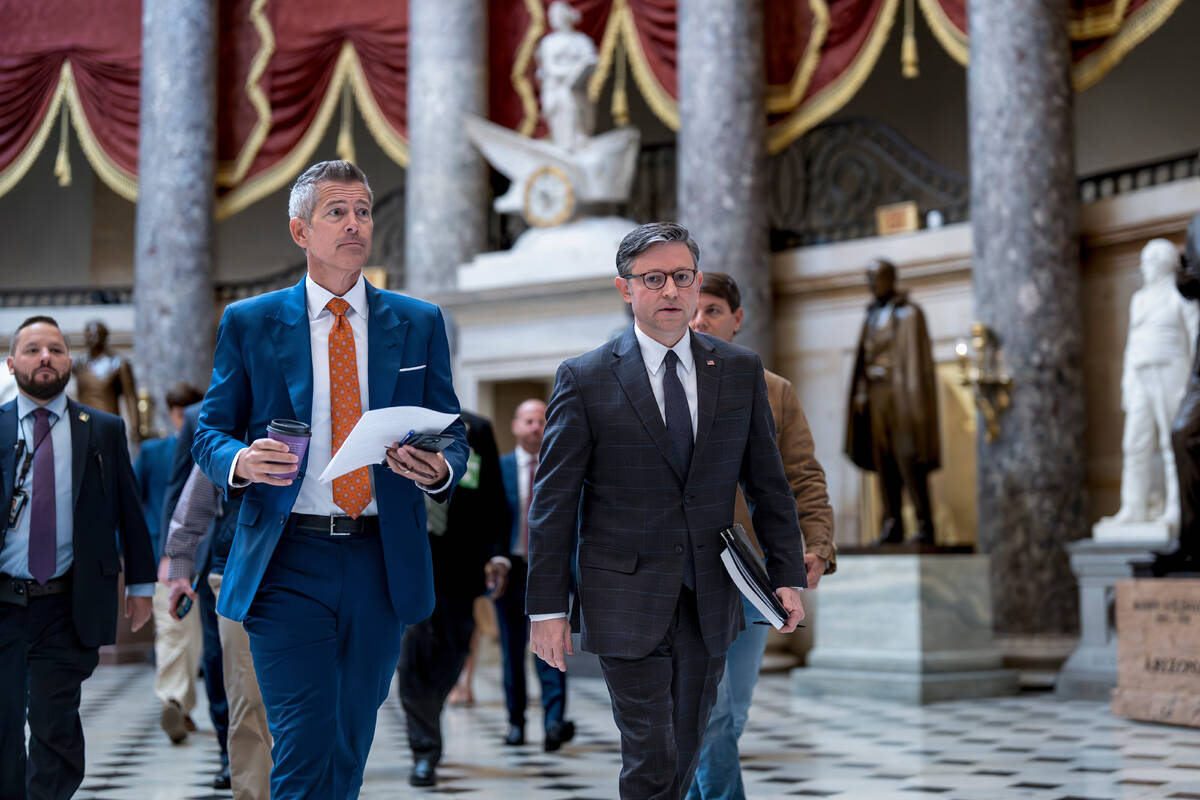 Transportation Secretary Sean Duffy, left, and Speaker of the House Mike Johnson, R-La., walk t ...