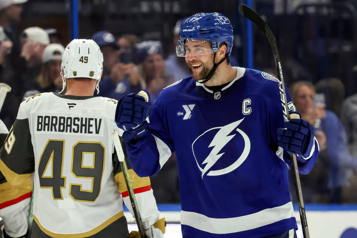 Tampa Bay Lightning's Victor Hedman, right, celebrates an overtime win against the Vegas G ...