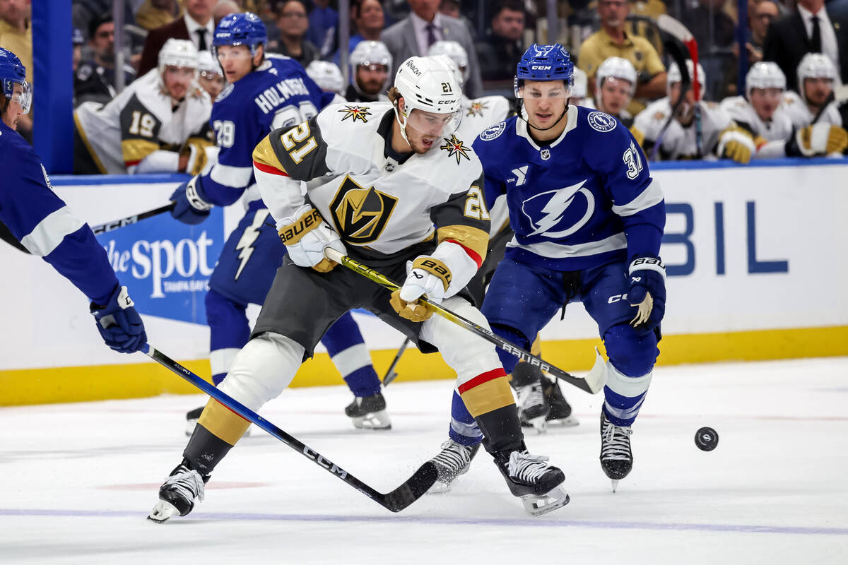 Vegas Golden Knights' Brett Howden (21) controls the puck in front of Tampa Bay Lightning& ...