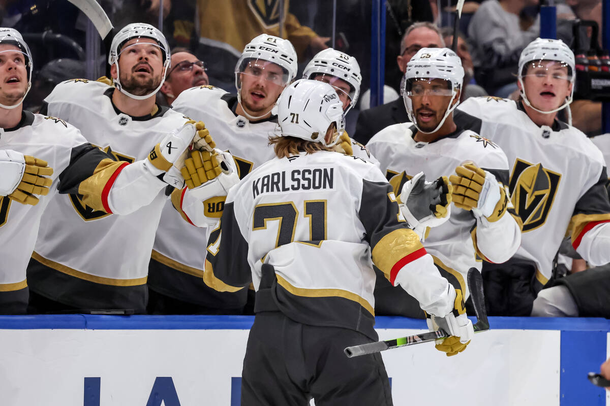 Vegas Golden Knights' William Karlsson, center, celebrates after his goal against the Tamp ...