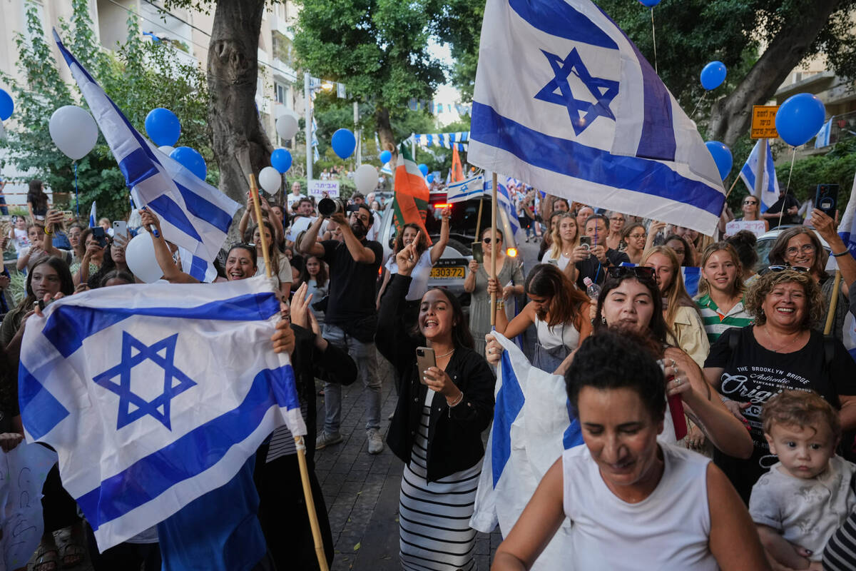 People celebrate as freed Israeli hostage Evyatar David, recently released from Hamas captivity ...