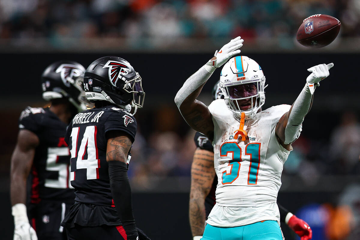 Miami Dolphins running back Ollie Gordon II (31) reacts during the first half of an NFL footbal ...