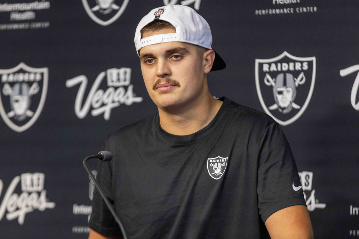 Raiders quarterback Aidan O'Connell takes media questions during a news conference followi ...