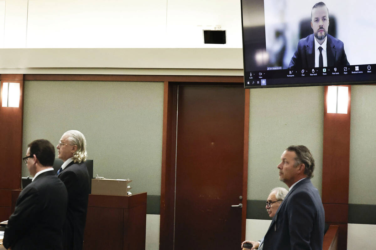 Israeli official Tom Alexandrovich, top/right, appears via Zoom for his arraignment hearing at ...
