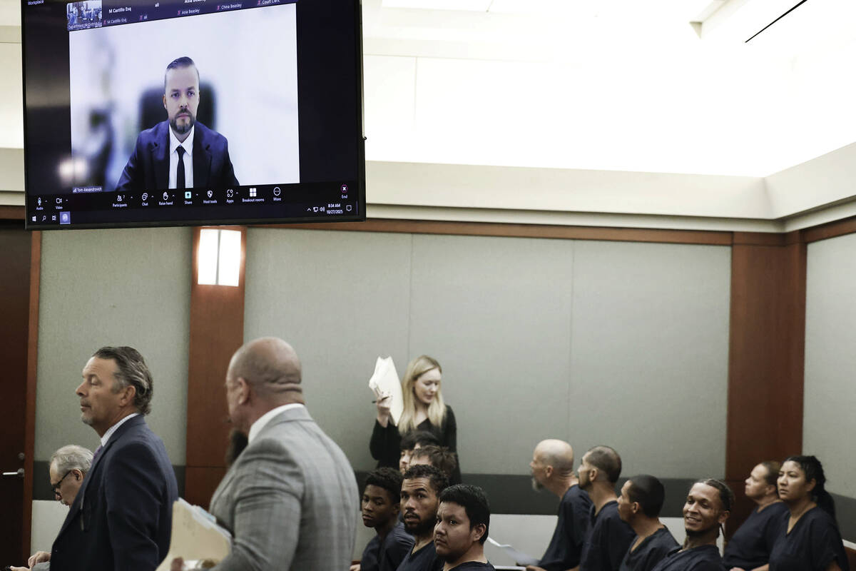 Israeli official Tom Alexandrovich, top/left, appears via Zoom for his arraignment hearing at t ...
