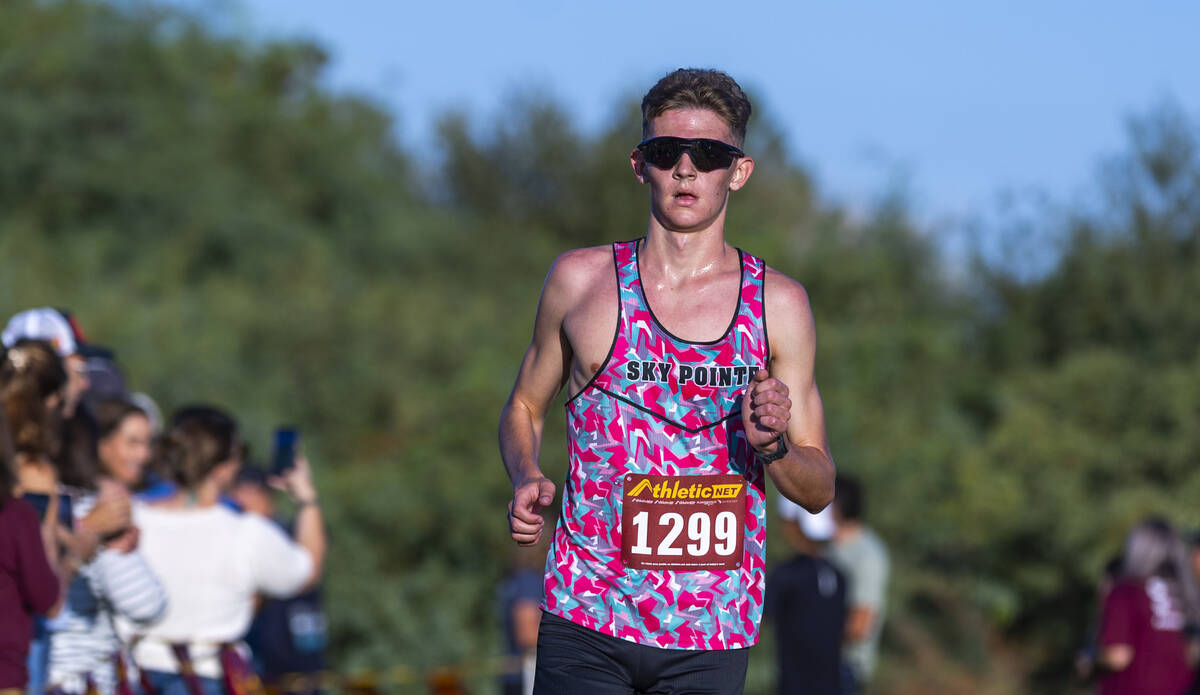 Somerset Academy Sky Pointe High School runner Carter Prater (1299) nears the finish to ta ...