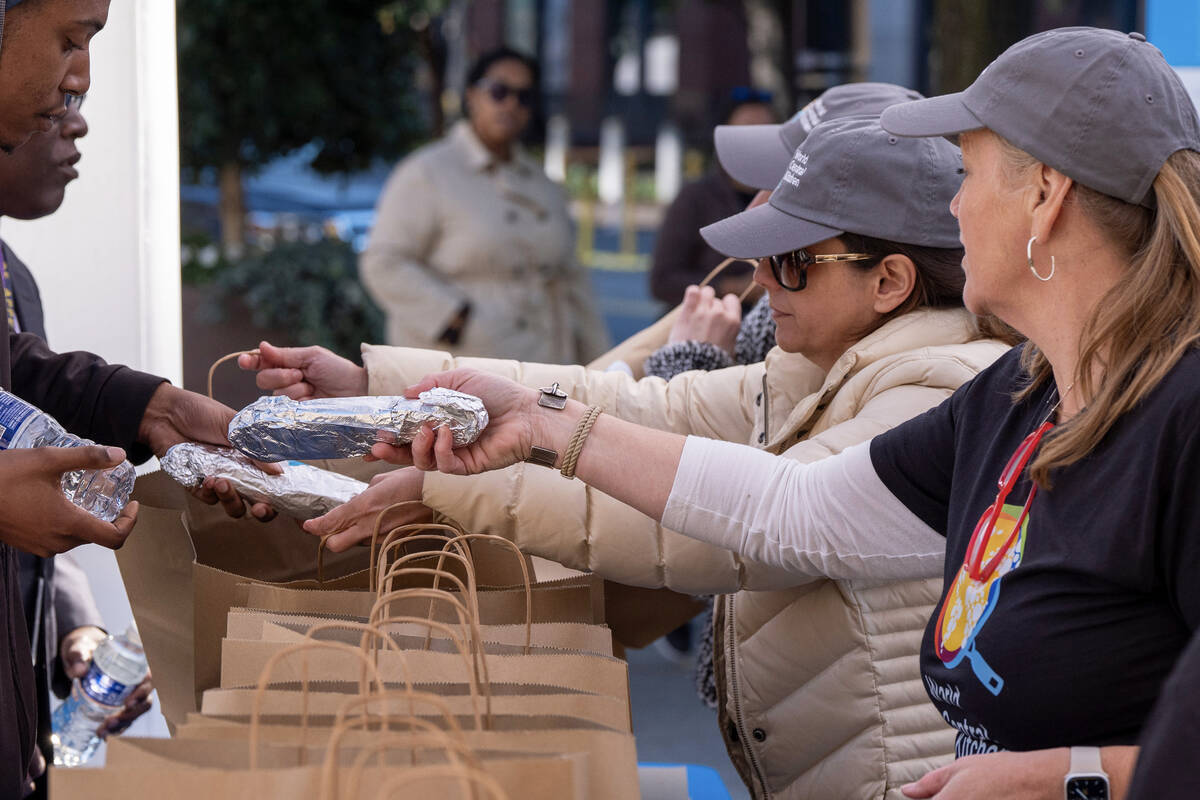Workers with chef Jose Andres' World Central Kitchen distribute more than 1100 meals for f ...