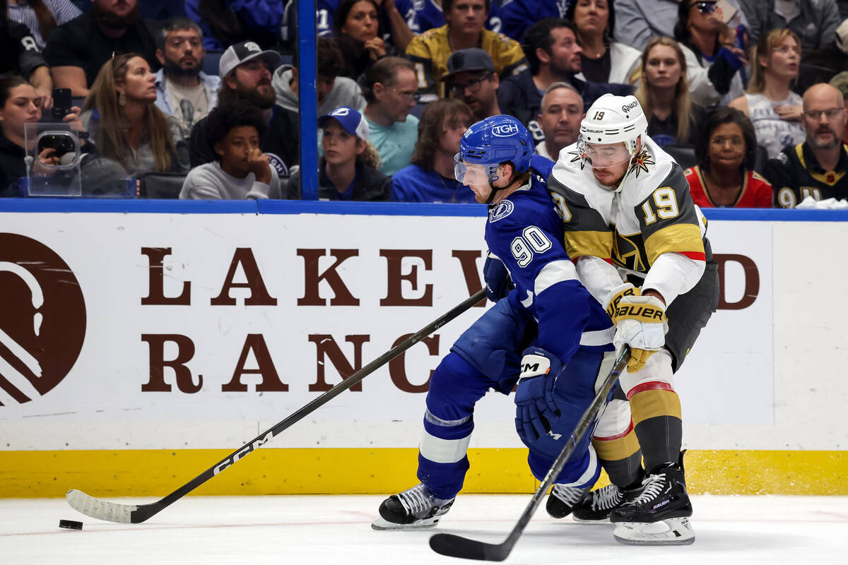 Tampa Bay Lightning's J.J. Moser (90) skates past Vegas Golden Knights' Reilly Smith ...